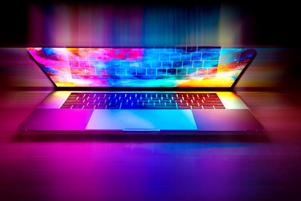 Futuristic laptop displaying holographic AI interface with neural network visualizations